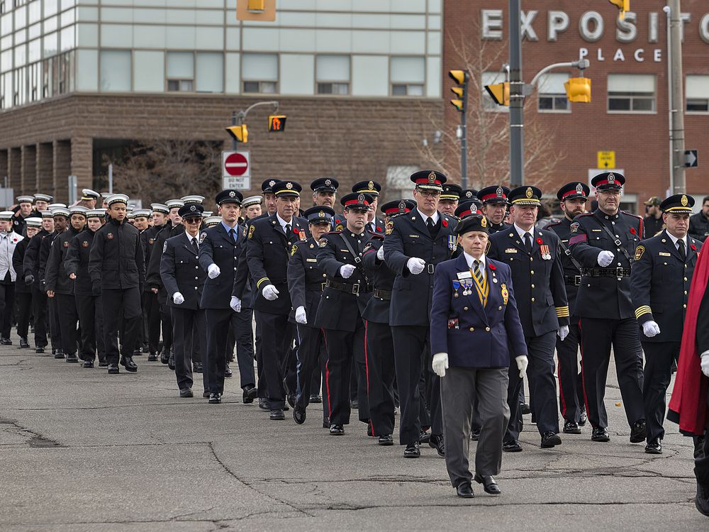Veterans, police, fire personnel and cadets march along Dalhousie street on Sunday morning to the Brant County War Memorial - Brian Thompson/Brantford Expositor/Postmedia Network